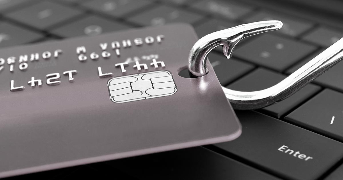 Hameçon qui tient une carte bancaire illustrant une tentative de phishing